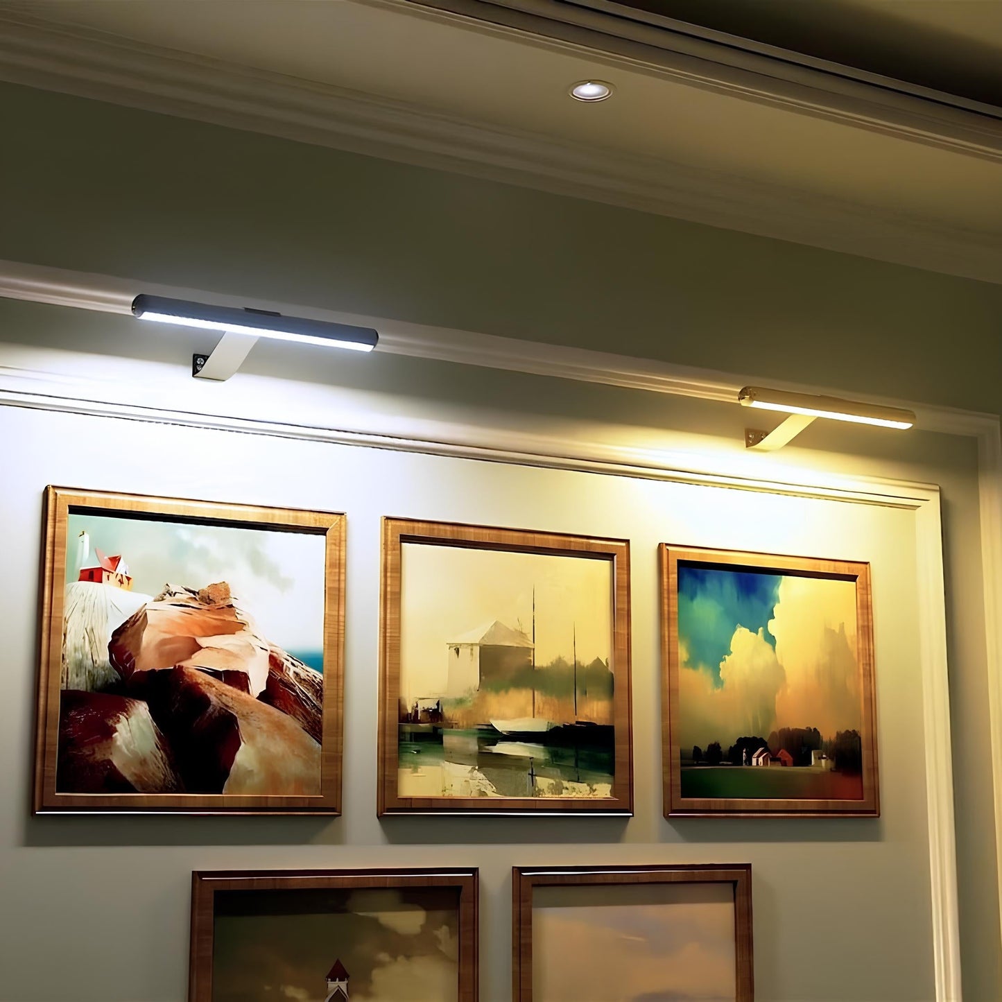 Cordless LED picture wall light with a slim white bar housing and small wall bracket.