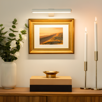 White LED picture wall sconce with a slim bar housing and small center bracket.