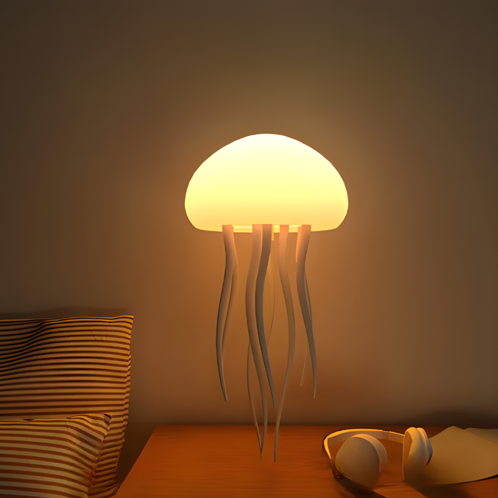 LED jellyfish night light with warm glowing dome and white tentacles