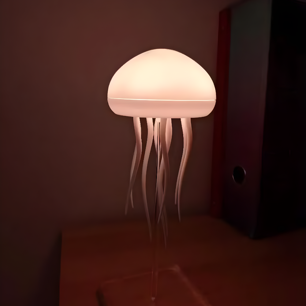 LED jellyfish night light with warm glowing dome and white tentacles