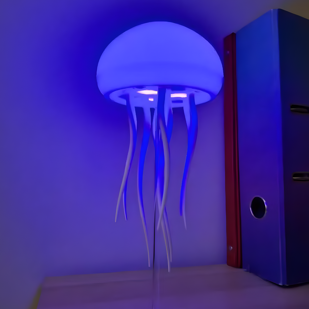 LED jellyfish night light silicone lamp with glowing dome and dangling tentacles, blue