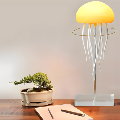 LED jellyfish night light with glowing dome on clear base and white tentacles