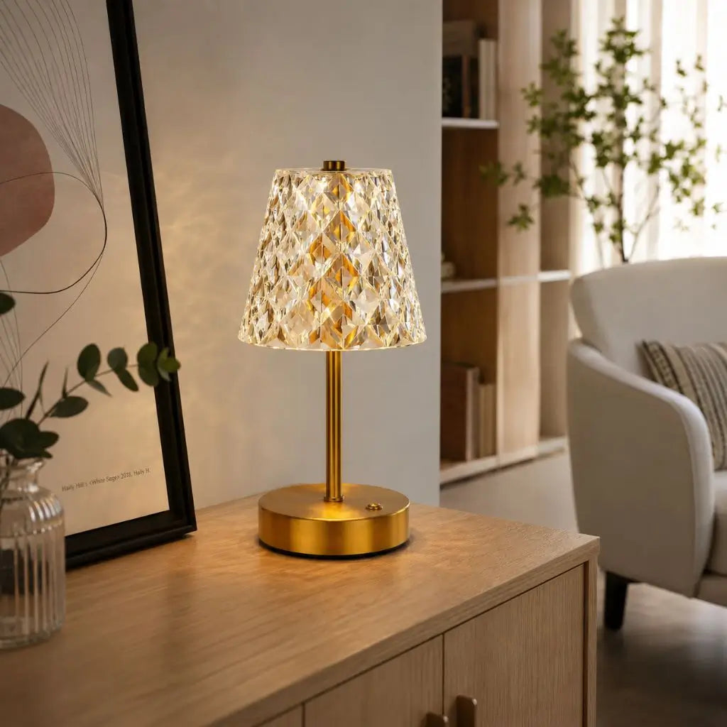 Cordless crystal pattern table lamp with brushed gold metal base and faceted shade