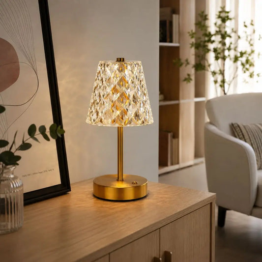 Cordless crystal pattern table lamp with brushed gold metal base and faceted shade