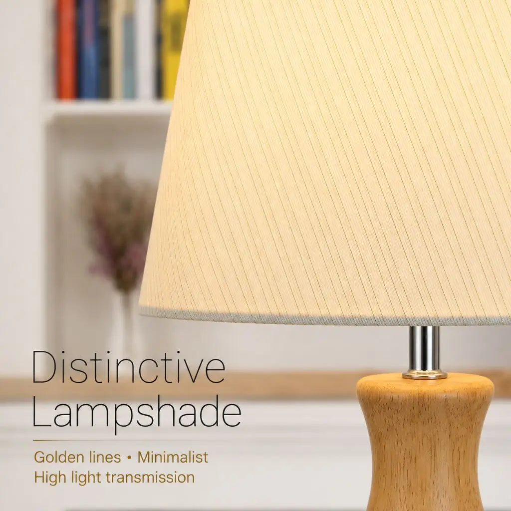 White fabric lampshade with fine lines and wooden lamp base with metal neck