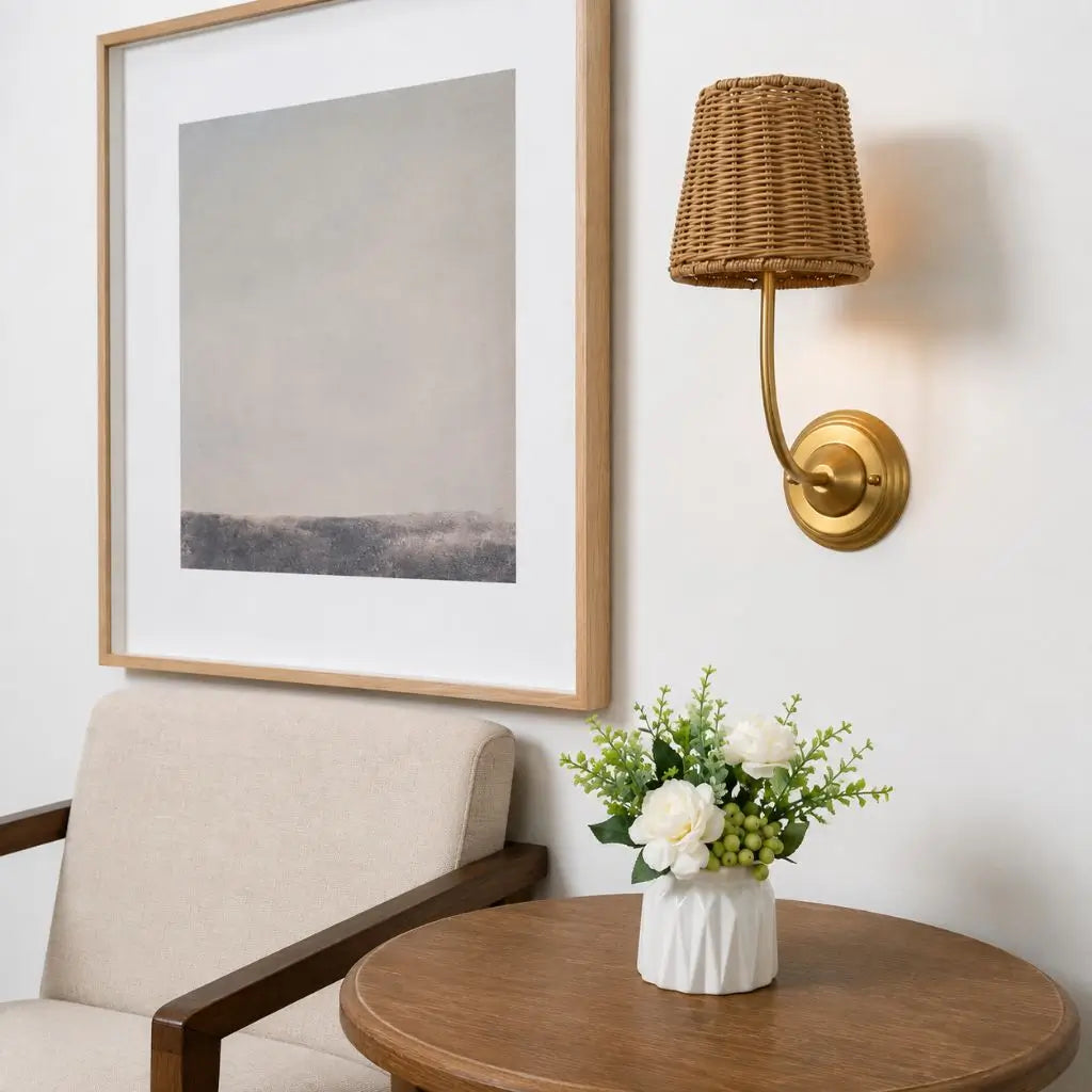 Antique rattan wall lamp with woven conical shade and gold circular wall mount