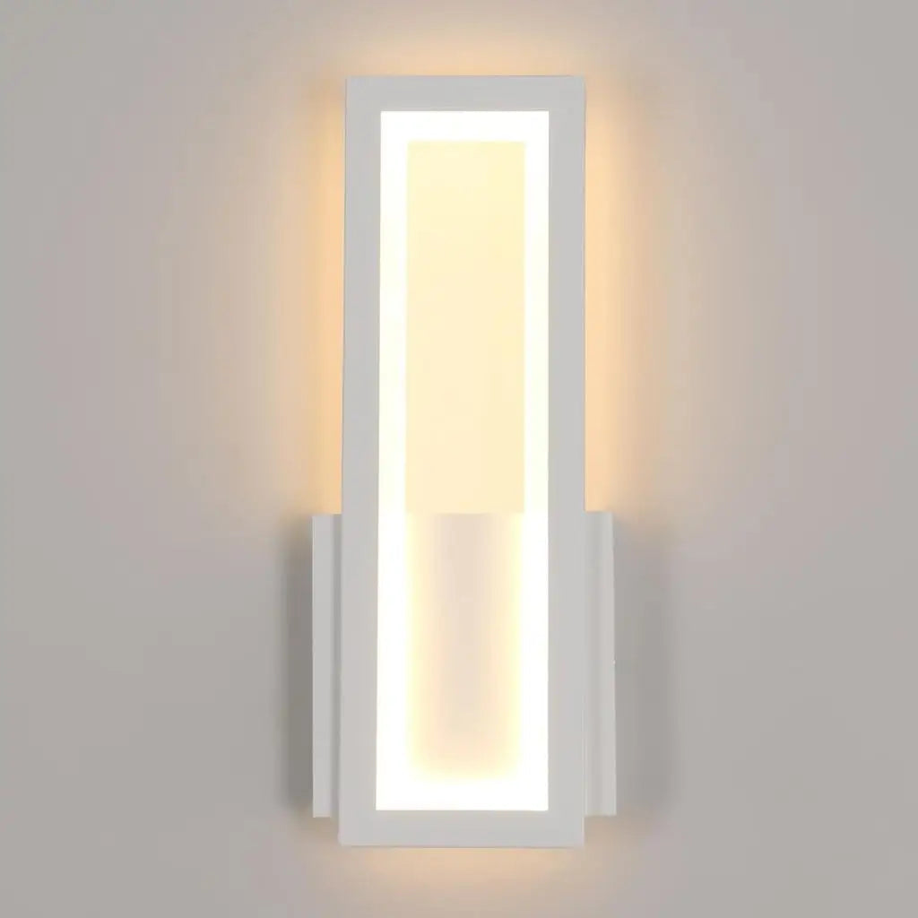 Wall-mounted LED light with white frame and glowing rectangular acrylic panel