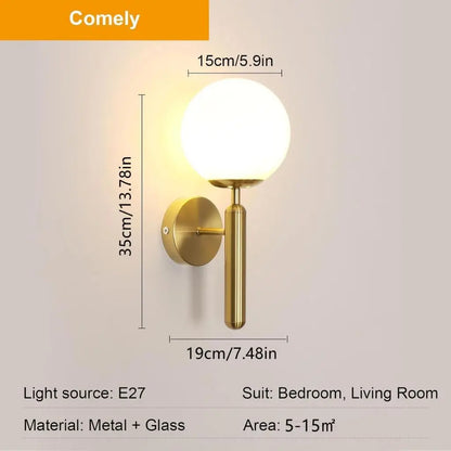 Gold wall sconce with milky glass globe shade and round wall backplate, E27 socket