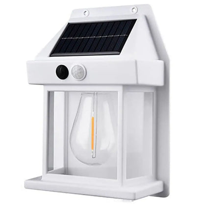 White solar-powered fence wall light with clear lamp cover and solar panel