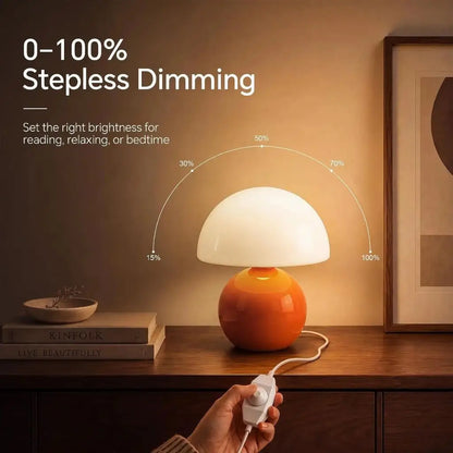 Orange mushroom table lamp with frosted glass shade and glossy ceramic base