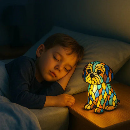 Warm LED stained glass dog night light on bedside table, colorful mosaic