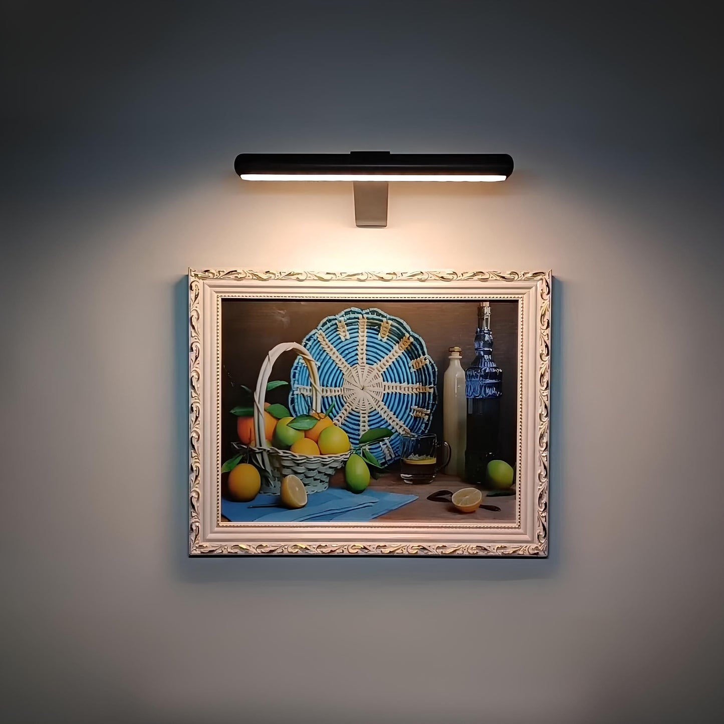 Black LED picture wall sconce with a slim rectangular bar and center mount.
