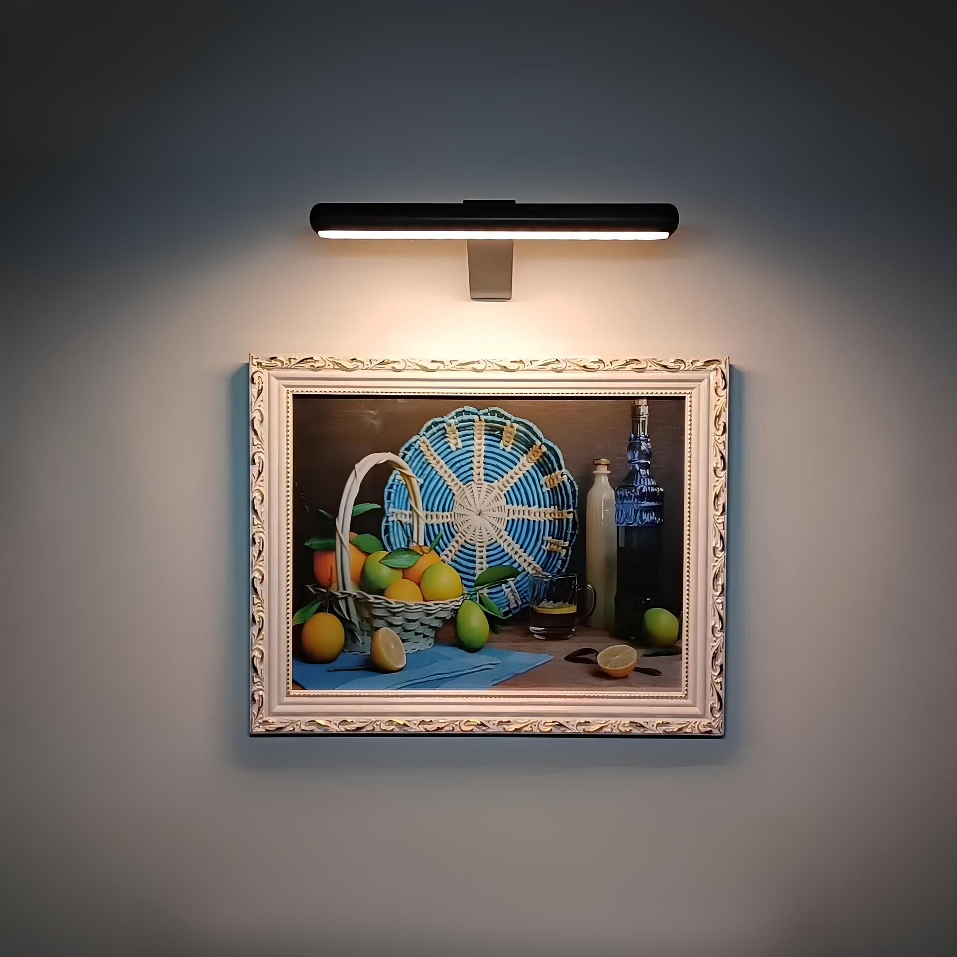 Black LED picture wall sconce with a slim rectangular bar and center mount.