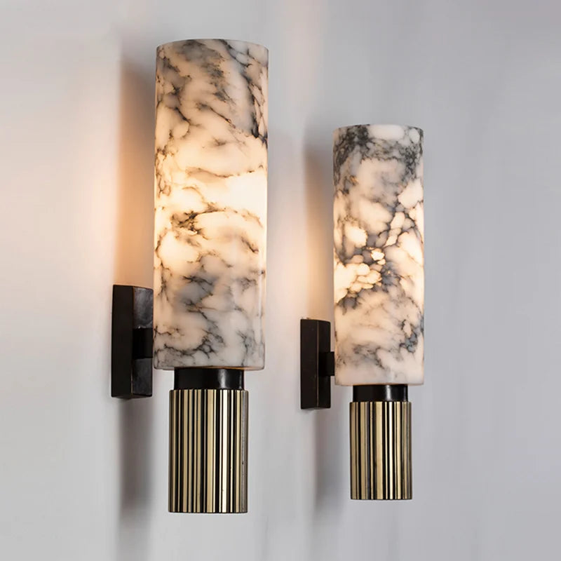 Set of wall lights with marble-effect cylinder shades, black brackets, gold ribbed accents