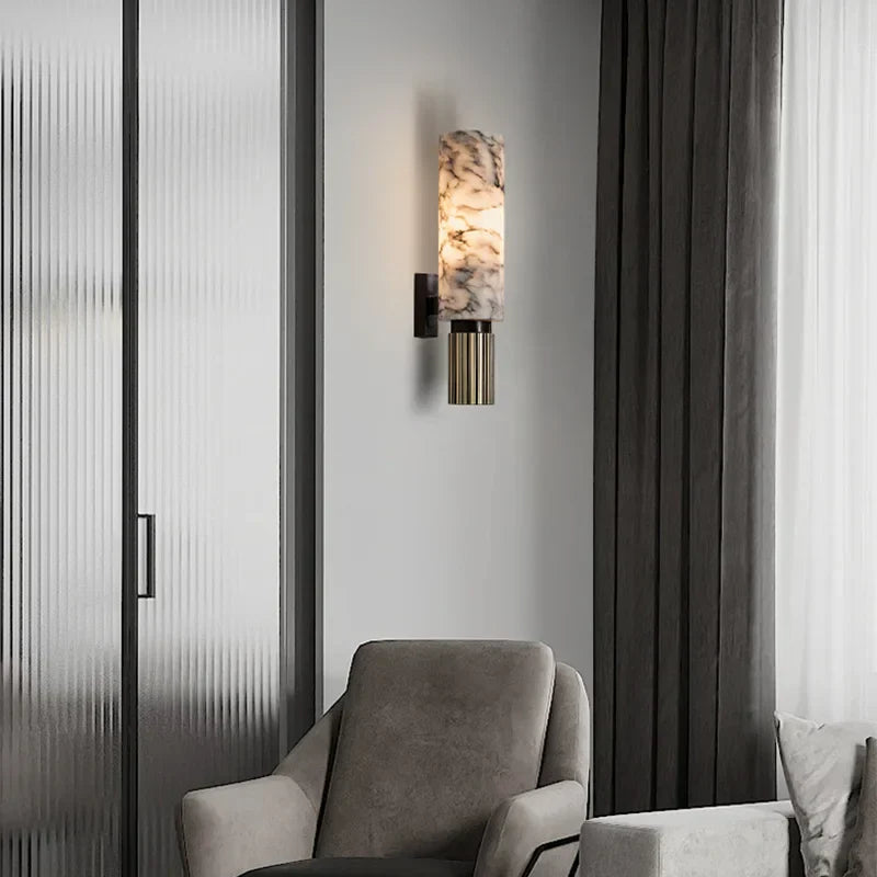 Wall light with marble-effect glass cylinder shade and gold ribbed metal base, black mount