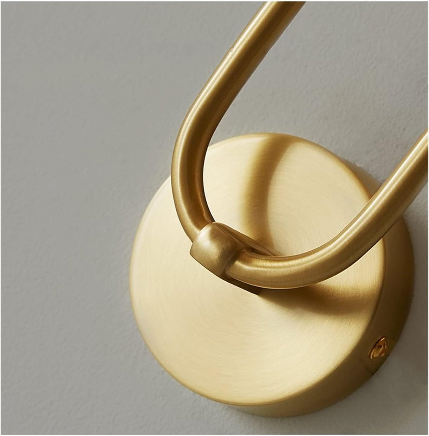 Gold circular backplate with curved metal arm and warm white LED cylinder lamp