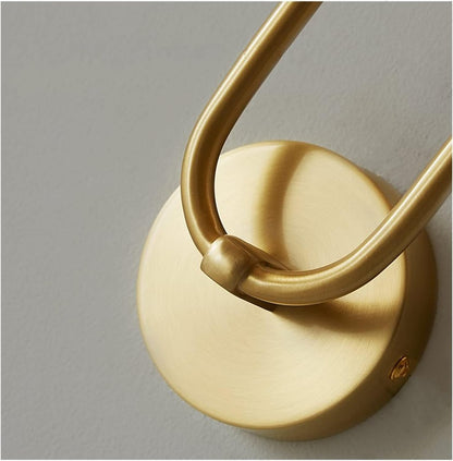 Gold circular backplate with curved metal arm and warm white LED cylinder lamp