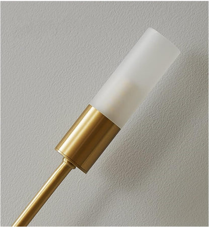 Gold metal wall light with frosted cylindrical shade and warm white LED bulb