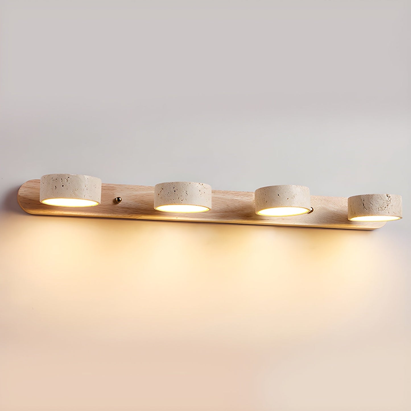 Wall LED light with natural wood bar and four speckled stone-look cylinder shades, warm glow