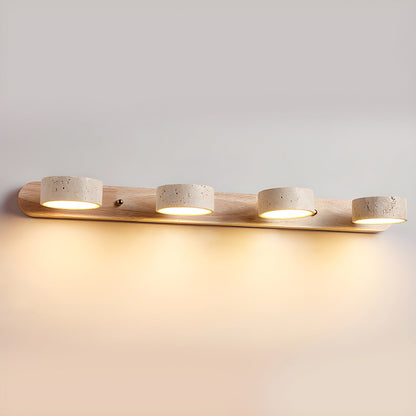 Wall LED light with natural wood bar and four speckled stone-look cylinder shades, warm glow
