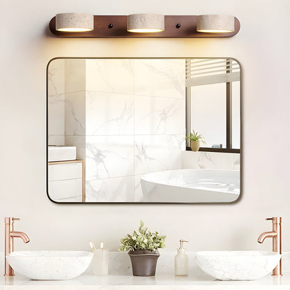 Wood-look LED wall light with three illuminated cylinder shades on a wooden mounting bar