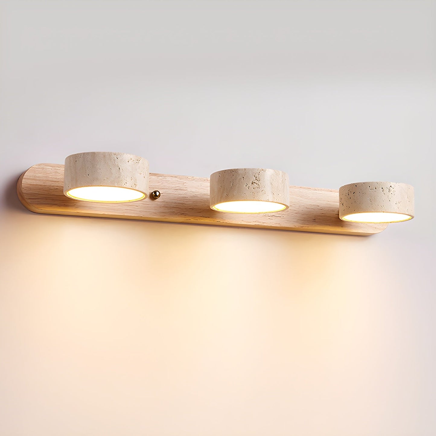 Wall LED light with natural wood bar and three speckled stone-look cylinder shades, warm glow