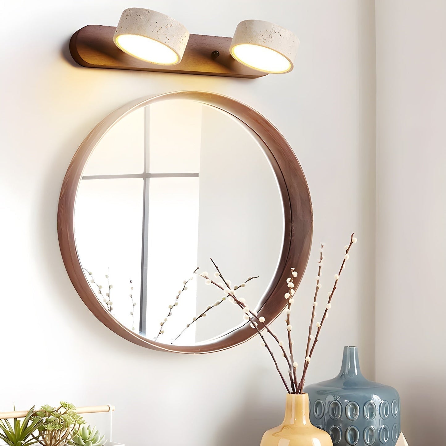 LED wall light with two stone-look shades on a wood-look wall bar, warm light