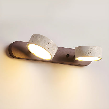 LED wall light with two stone-look shades on a wood-look bar, soft warm glow