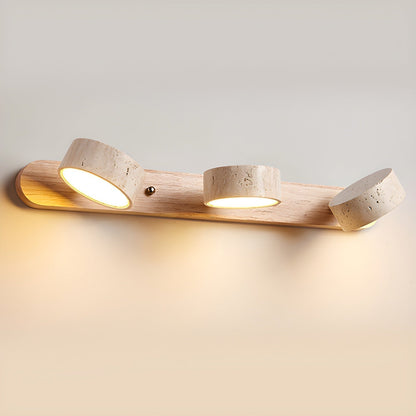 Wall LED light with natural wood bar and four speckled stone-look cylinder shades, side view