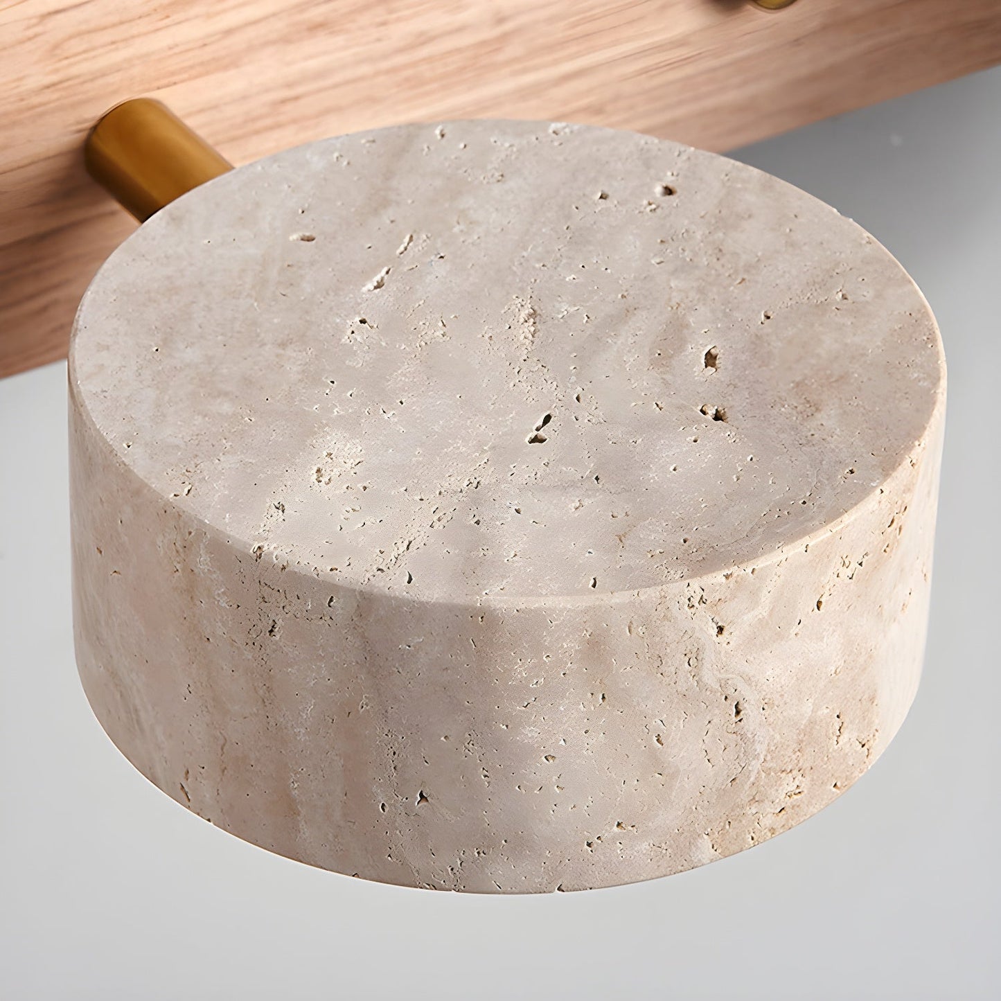 Stone-look cylindrical LED wall light shade with speckled texture, close-up