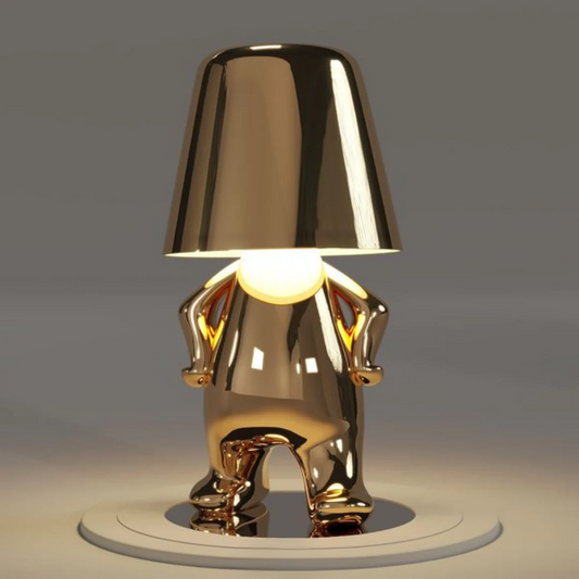 Gold modern figurine table lamp, wide conical shade over sculpted torso, LED illumination