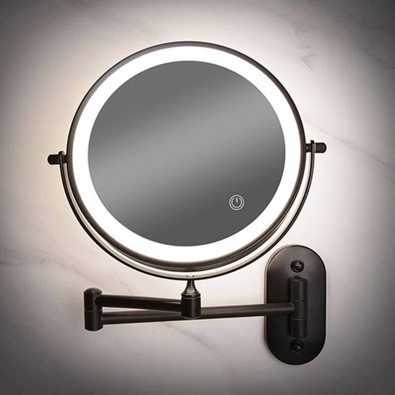 Round LED wall mirror with bright white light ring, stainless accents, and magnification
