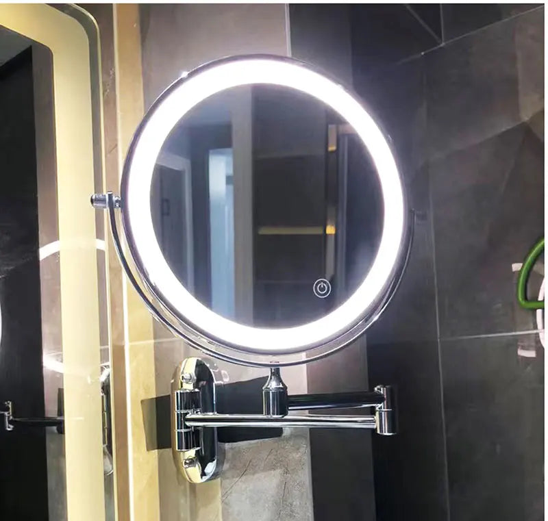 Round LED magnifying mirror with glowing ring and dark wall bracket, adjustable arm