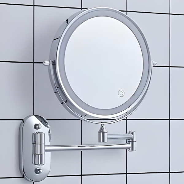 Circular chrome LED magnifying mirror on wall with hinge bracket and light ring