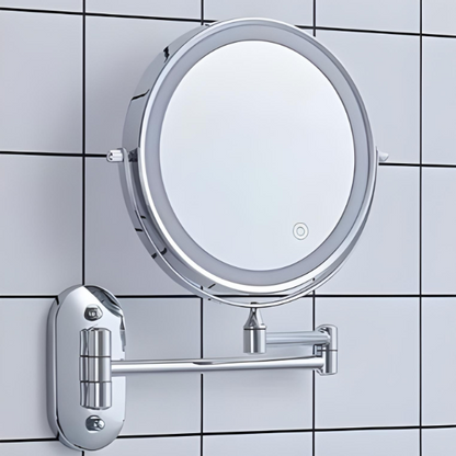 Circular chrome LED magnifying mirror on wall with hinge bracket and light ring
