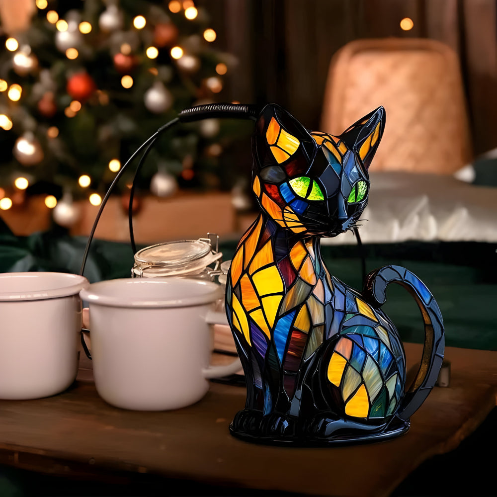 Warm-lit stained glass cat table lamp with orange and blue mosaic details