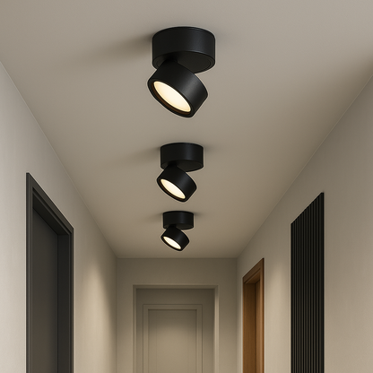Cluster of black LED ceiling spotlights with angled shades and warm light.