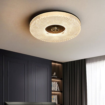 Round LED ceiling light with textured acrylic pattern and gold-toned center plate