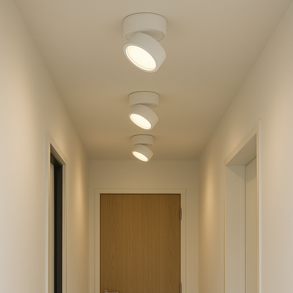 White LED ceiling spotlight with round flush mount and warm circular lens.