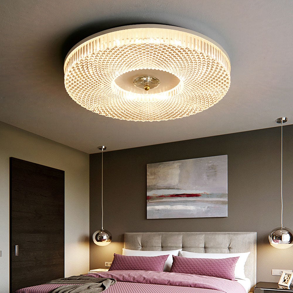 Circular acrylic LED ceiling light with textured halo and gold-toned central fixture