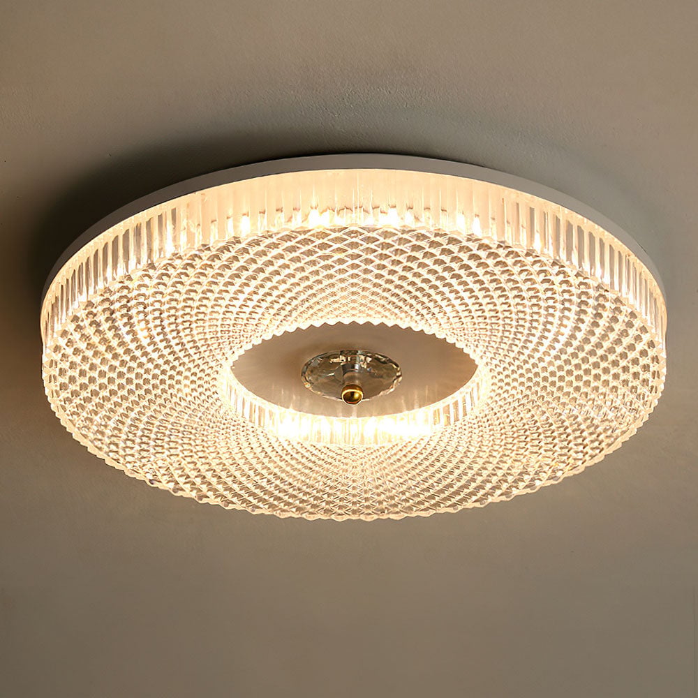 Close-up round LED ceiling light with acrylic mesh shade and gold-toned center
