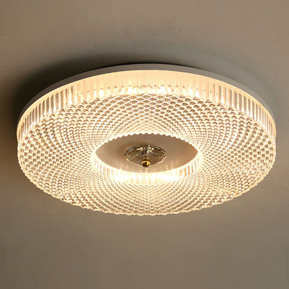 Close-up round LED ceiling light with acrylic mesh shade and gold-toned center