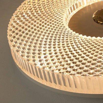 Angled close-up of circular acrylic LED ceiling light with textured crystal-like mesh