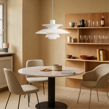 White pendant light with layered shades over dining table