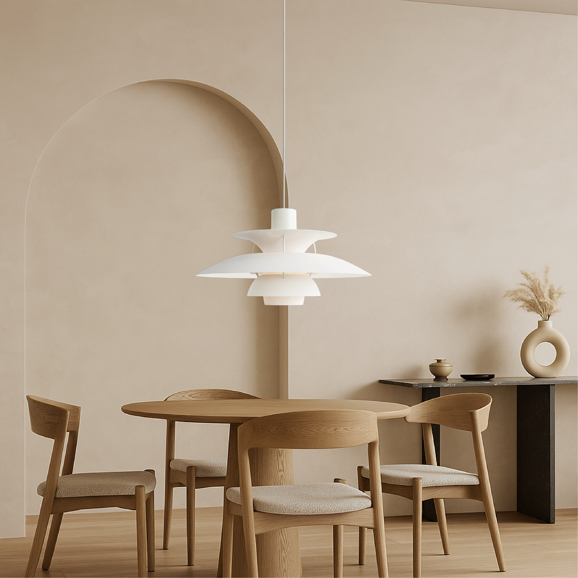 White pendant light with multiple stacked bell shades, hanging with visible cord