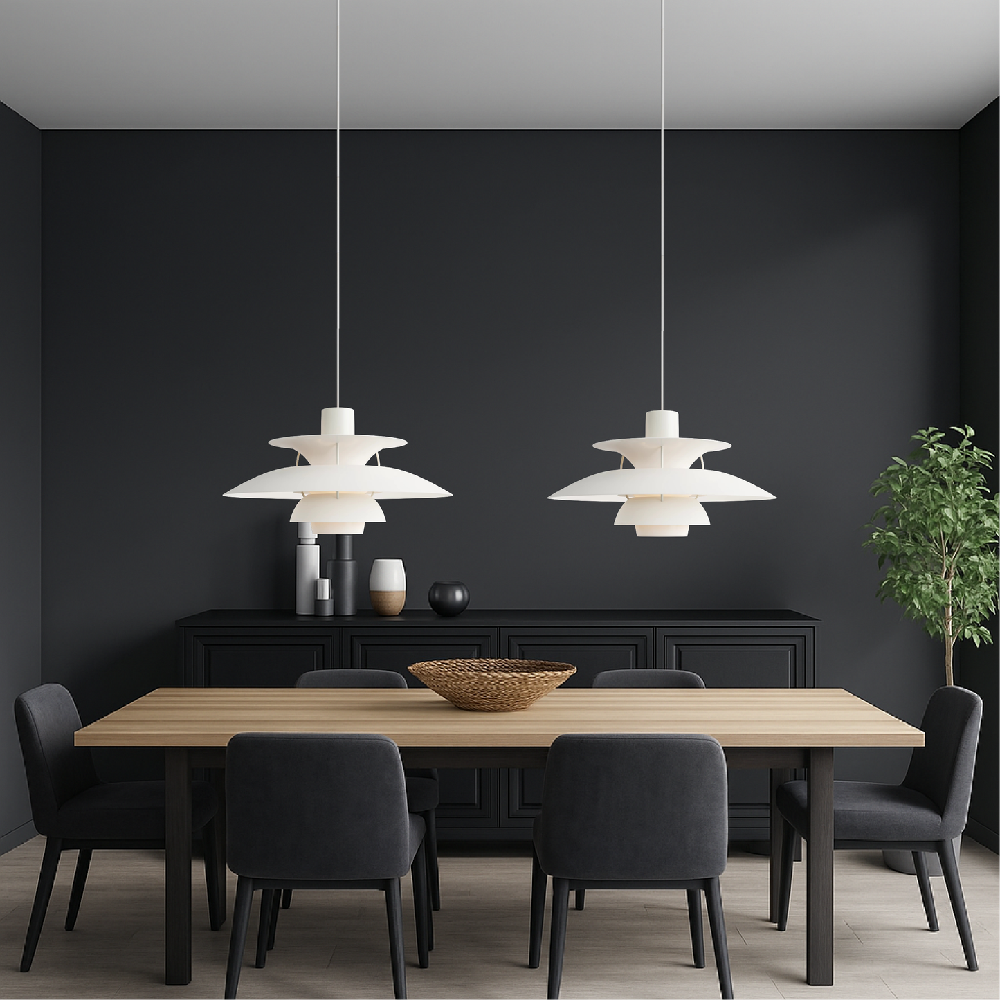 Pair of white pendant lights with stacked bell shades above dark dining table and chairs