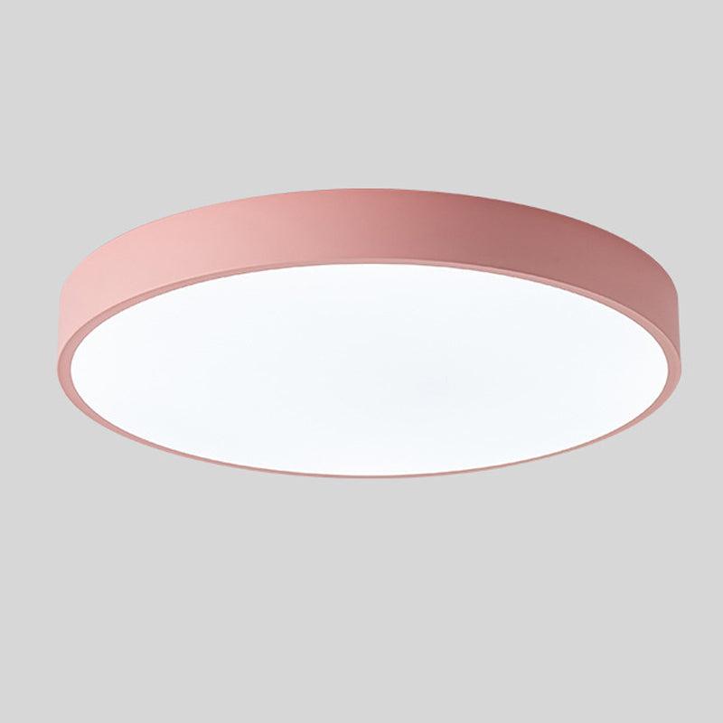 Round ceiling light with white acrylic diffuser and pink metal rim