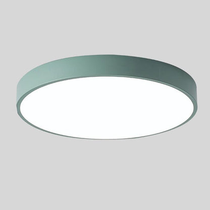 Round ceiling light with white acrylic diffuser and green metal rim