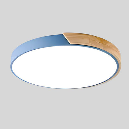Round ceiling light with white acrylic diffuser and blue metal rim, warm wood accent