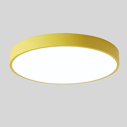 Round ceiling light with white acrylic diffuser and yellow metal rim